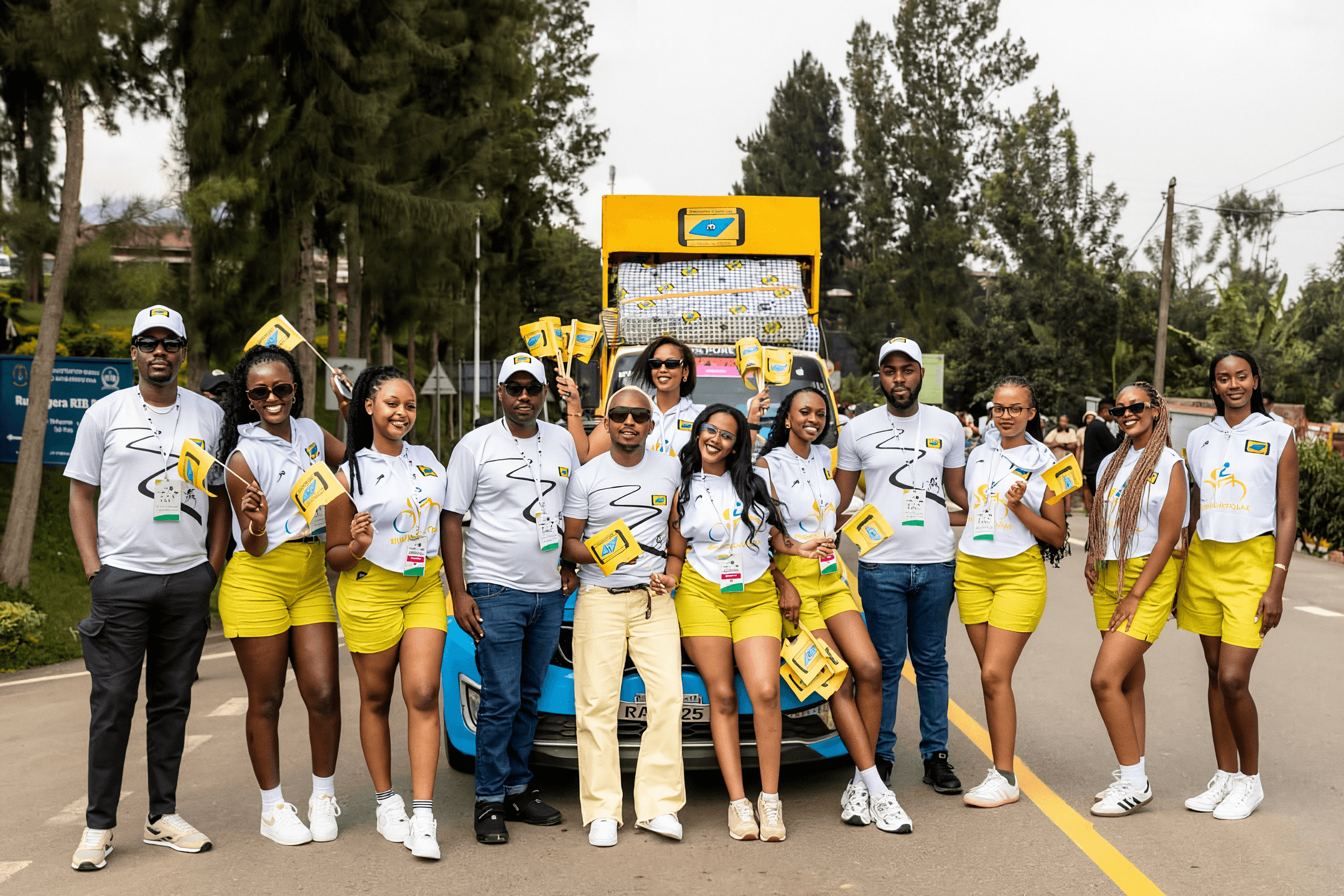 RwandaFoam team gathered in front of a branded event vehicle